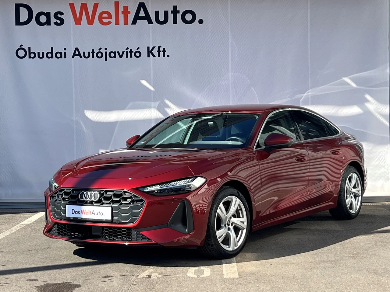 Audi A5 2,0 150 kW TDI Automatik Baujahr 2025, Gránátalmavörös metál, 28.975 km, Ungarn — Foto 1 | AMOTOR Audi A5 2,0 150 kW TDI Automatik Baujahr 2025, Gránátalmavörös metál, 28.975 km, Ungarn — Foto 1